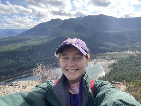 Grace in front of lake and mountains